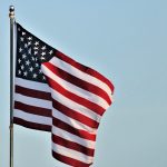 american-flag-on-blue-sky